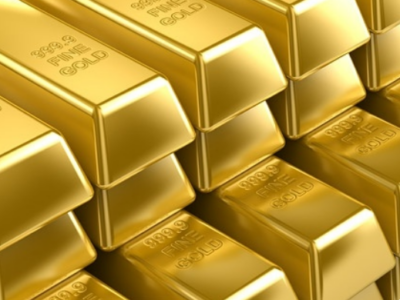 Stack of gold bars with fine gold markings.